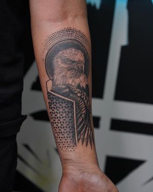 Intricately detailed blackwork eagle and ornamental pattern design by Soheyl Astangi, perfect for the forearm.