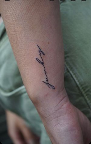 Fine line and small lettering name and quote tattoo on forearm, created by the talented artist Miss Vampira.