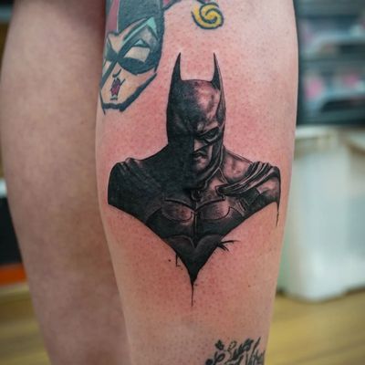 Blackwork style bat tattoo on lower leg by Soheyl Astangi, combining elements of Batman and micro realism.
