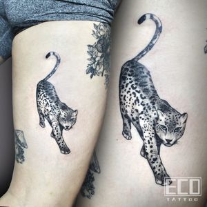 Exquisite black and gray design of a fierce leopard by Lin Feng, perfect for the upper arm. Show off your wild side with this stunning piece!