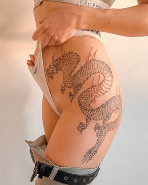 Experience the power and beauty of a Japanese dragon tattoo on your hip, expertly crafted by the talented artist Federico Tronconi.