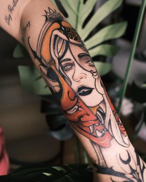 Intricate design by Jacky Yang featuring a captivating hannya mask, blending traditional and contemporary styles on the forearm.
