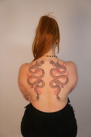 Experience the unparalleled beauty and power of a Japanese dragon tattoo expertly crafted by Federico Tronconi on your back.