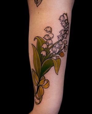A stunning floral design by artist Edyta, featuring vibrant colors and intricate details, perfect for your forearm.