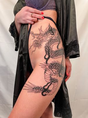 Experience the power and beauty of a traditional Japanese dragon tattoo by Federico Tronconi on your upper leg. Embrace the symbolism and mastery of this timeless design.