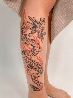 Get an incredible Japanese dragon tattoo by master artist Federico Tronconi on your lower leg. Embrace the power and beauty of this mythical creature.