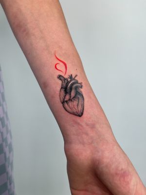 Get a stunning micro realism heart tattoo on your forearm by the talented artist Federico Tronconi. Capture love in every detail.
