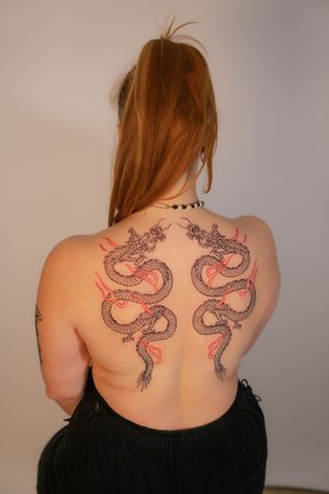 Experience the power and beauty of a traditional Japanese dragon inked by Federico Tronconi on your upper back.