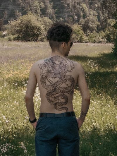 Experience the power and beauty of a Japanese dragon in this stunning back piece by Federico Tronconi.