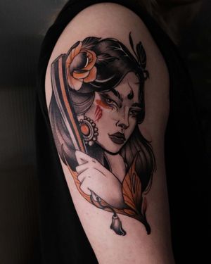 Adorn your upper arm with a stunning neo-traditional tattoo of a girl holding a fan, expertly inked by Jacky Yang.