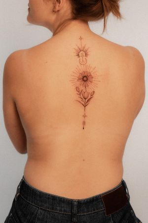 Elegant and intricate sunflower tattoo by Federico Tronconi, perfect for the upper back placement.