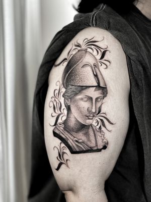 Experience the power and strength of a knight in this realistic black and gray tattoo by Federico Tronconi.