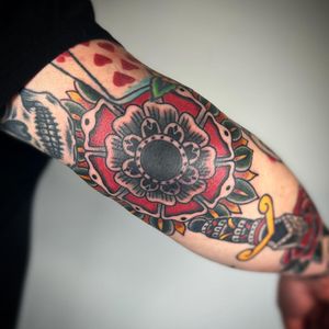 Elegant ornamental mandala tattoo by Claudia Trash, perfect for the elbow area. Classic and intricate design.