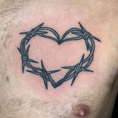 Get inked by Claudia Trash with this classic traditional tattoo design featuring a heart wrapped in barbed wire. Guaranteed to make a bold statement!