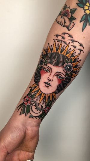 Get a stunning neo traditional tattoo of a woman on your forearm by the talented artist Claudia Trash. Bold colors and intricate details will bring this design to life!