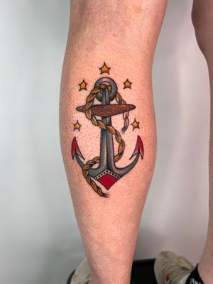 Classic tattoo featuring an anchor entwined with rope, expertly done by Claudia Trash on the lower leg. A timeless nautical design!