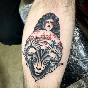 Beautiful traditional tattoo featuring a goat and a woman on the lower leg by Claudia Trash.