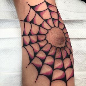 Embrace your dark side with Claudia Trash's stunning spider and web design on your elbow. Fine line details add a touch of elegance to this edgy motif.