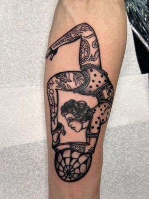 Unique forearm tattoo by Claudia Trash featuring intricate dotwork and fine line detailing of a woman and pattern motif.