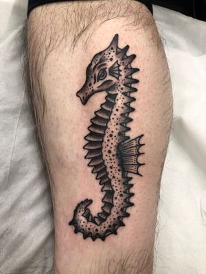 Unique black and gray seahorse design on the lower leg, beautifully crafted by Claudia Trash.