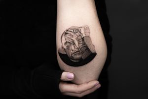 Capture the essence of the legendary artist with a black and gray realism tattoo on your chest in Berlin, DE.