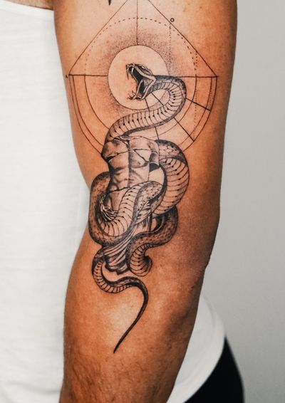 Black and gray fine line design by Gabriele Edu featuring a geometric snake pattern on the arm.