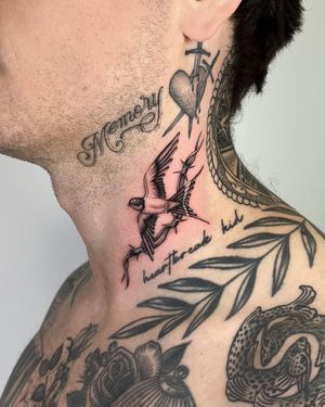 Get a stunning black and gray micro realism tattoo of a swallow bird with barbwire on your neck by Joshua Williams.
