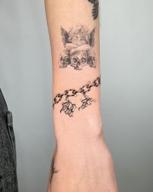 Get a stunning black and gray forearm tattoo featuring a chain motif intertwined with bold lettering, designed by tattoo artist Joshua Williams.