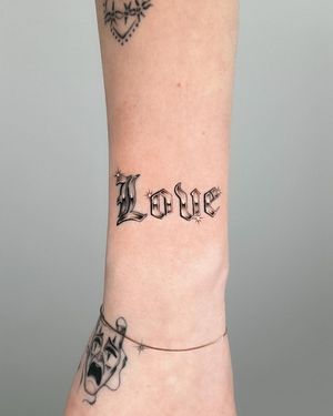 Get inspired with this beautiful lettering tattoo by Joshua Williams, featuring a heartfelt love quote on your forearm.