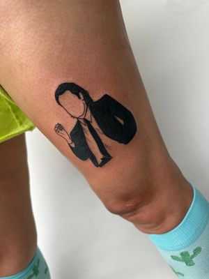 Bold blackwork piece of John Travolta on upper leg by tattoo artist Miss Vampira. Paying homage to the legendary actor.