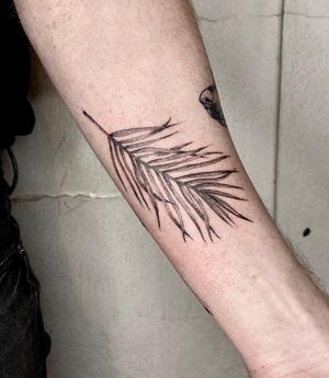 Elegant blackwork leaf tattoo on forearm by talented artist Jamie B, perfect for nature lovers.