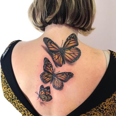 Experience the vibrant mix of new school and realism styles with this stunning butterfly tattoo by VV Swain Tattoo.