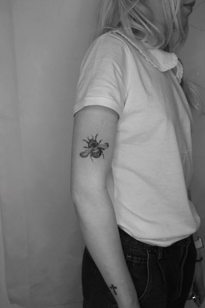 Explore the beauty of nature with this sleek blackwork bee tattoo by Jamie B. Perfect for those who appreciate simplicity and elegance.