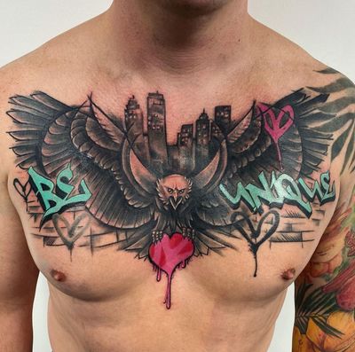 Impressive blackwork chest piece featuring an eagle and powerful quote by VV Swain Tattoo.