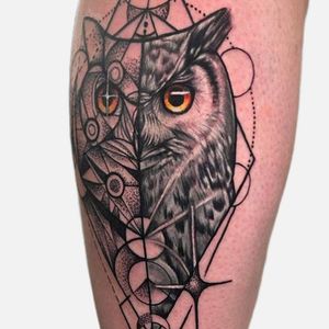 Get a stunning black and gray owl tattoo with intricate geometric patterns by VV Swain Tattoo.