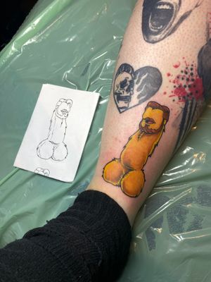Vibrant new school style tattoo on shin by artist Frankie Brown featuring a bold yellow ink penis motif.
