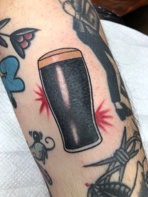 Raise a glass to Claudia Trash's traditional arm tattoo featuring a classic beer motif.