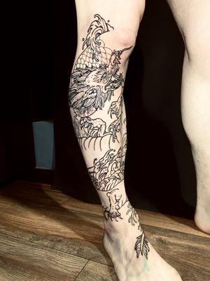 Fine line dragon tattoo on lower leg by Frankie Brown, with traditional Japanese style.