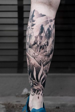 Experience nature and companionship with this black and gray tattoo by Luca Salzano on the lower leg. The intricate design features a dog, tree, and people, all beautifully executed in fine line style.