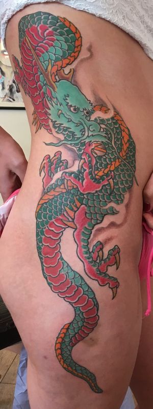 Get a fierce and intricate Japanese dragon tattoo on your ribs by renowned artist Kiko Lopes. Embrace the power and beauty of this legendary creature.