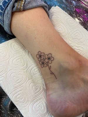 Elegant and delicate floral design for your ankle. Intricate fine line work by the talented tattoo artist Joanna Webb.
