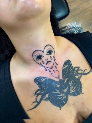 Unique design featuring heart, tears, and eyes in intricate dotwork and fine line style, expertly executed on the neck by talented artist Joanna Webb.