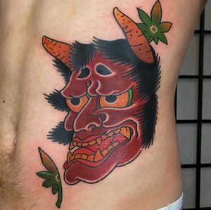 Experience the intense emotion of a traditional Japanese hannya mask tattoo by the talented artist Kiko Lopes on your ribs.