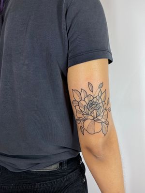 Adorn your upper arm with a stunning dotwork peony tattoo by Joanna Webb, featuring intricate floral details in fine line style.
