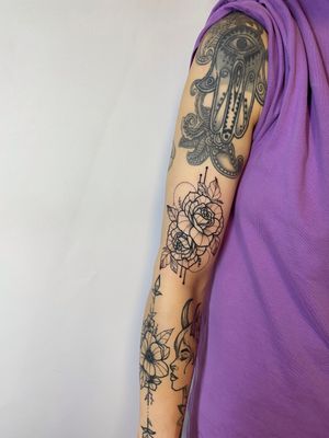 Beautiful flowr design by Joanna Webb, featuring fine line details and intricate dotwork on your arm.