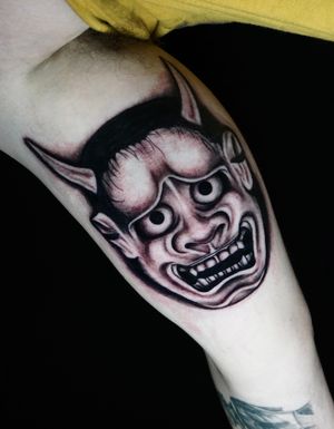 Experience the haunting beauty of a blackwork Japanese hannya mask tattoo by the talented artist Miss Vampira. Perfect for those seeking traditional Japanese tattoo designs.