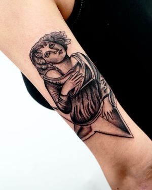 Embrace the power of femininity with this striking blackwork tattoo of a woman designed by Miss Vampira.