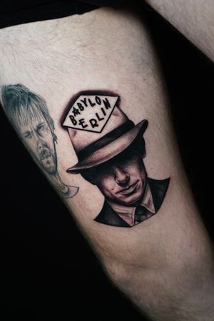 Unique blackwork tattoo on upper leg by Miss Vampira featuring a hat and man in stunning lettering style.