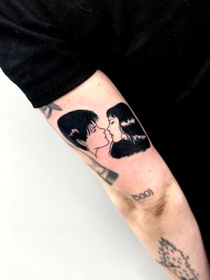 Experience the magic of blackwork with this stunning tattoo featuring a woman and man on your upper arm. Embrace the mystical connection between two souls.