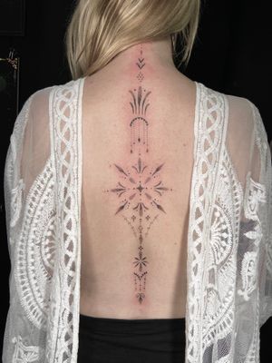 Unique dotwork pattern in ornamental style beautifully inked on the back by talented artist Viví Bogdanov.